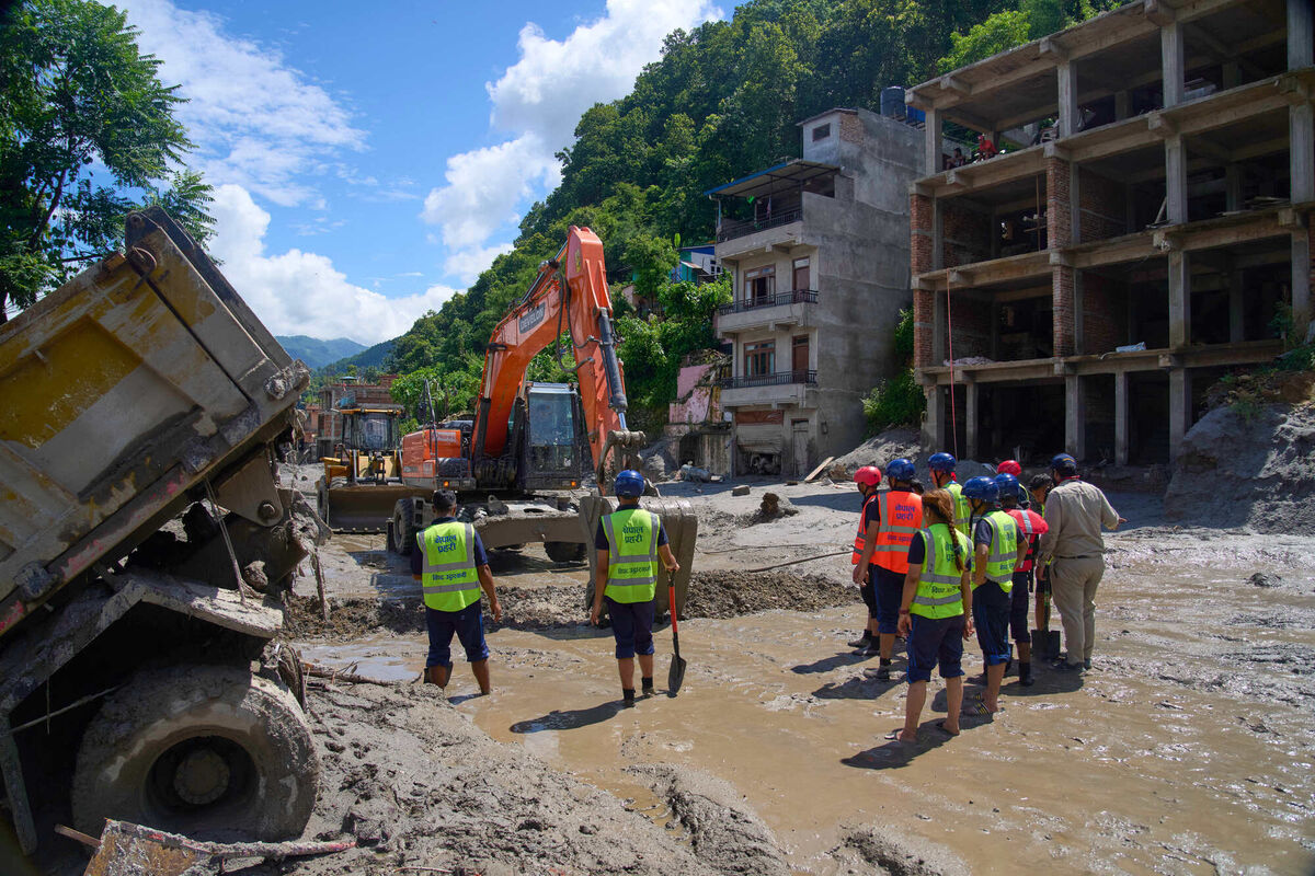 Earthmovers clear the debris from flash flooding in Nepal's Nuwakot district, Thursday, Aug. 27, 2026. (AP Photo/Niranjan Shrestha) Earthmovers clear the debris from flash flooding in Nepal's Nuwakot district, Thursday, Aug. 27, 2026. (AP Photo/Niranjan Shrestha)