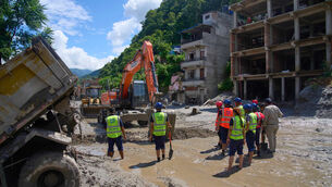 <p>Earthmovers clear the debris from flash flooding in Nepal's Nuwakot district, Thursday, Aug. 27, 2026. (AP Photo/Niranjan Shrestha)</p> <p>Earthmovers clear the debris from flash flooding in Nepal's Nuwakot district, Thursday, Aug. 27, 2026. (AP Photo/Niranjan Shrestha)</p>