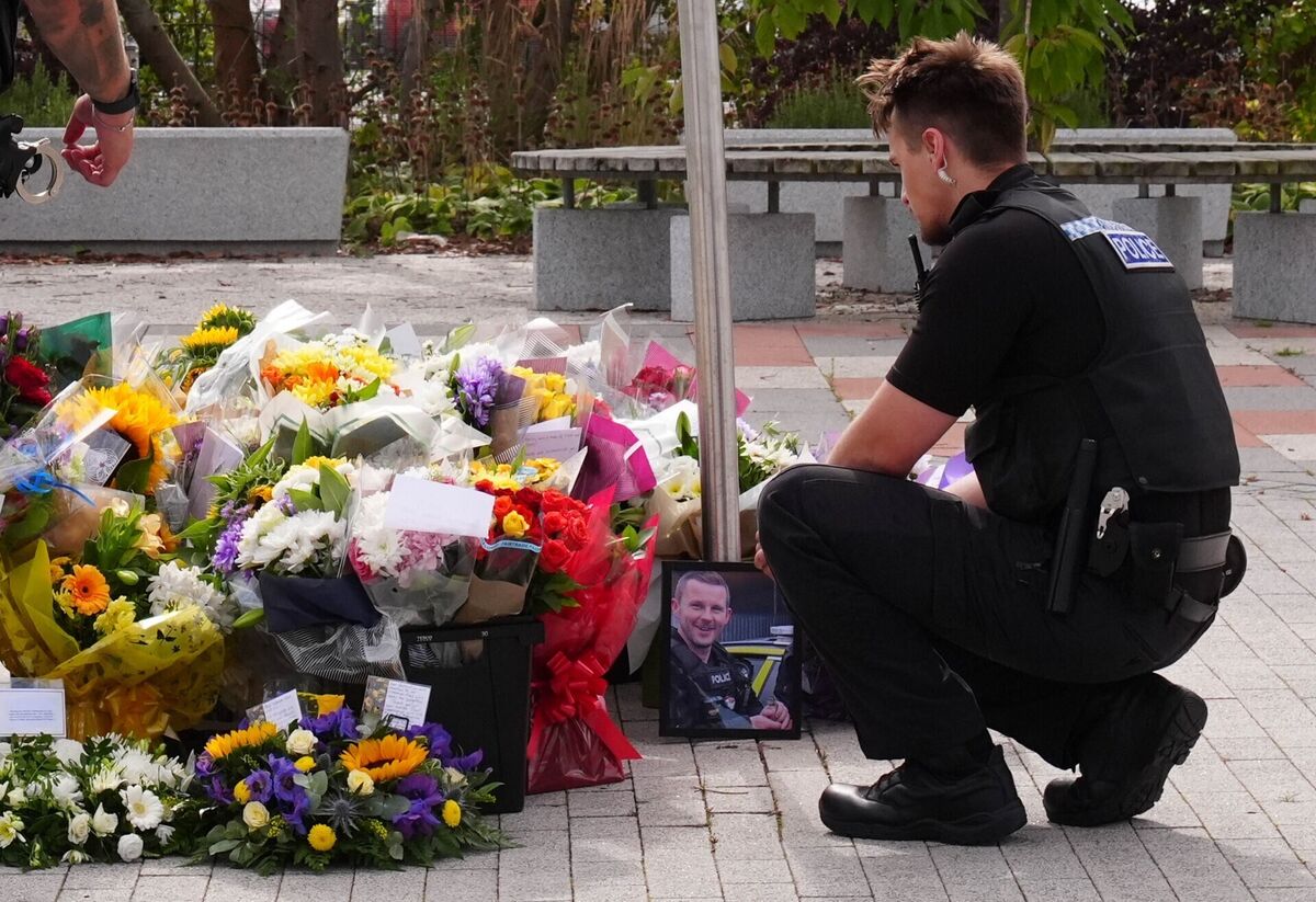Flowers at the Cleveland Police HQ in Middlesbrough, following the deaths of two policemen when a car going in the wrong direction hit their car on the A66. Picture:: Owen Humphreys/PA Wire Flowers at the Cleveland Police HQ in Middlesbrough, following the deaths of two policemen when a car going in the wrong direction hit their car on the A66. Picture:: Owen Humphreys/PA Wire