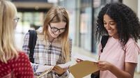 Female College Students Opening Exam Results