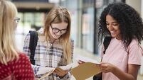 Female College Students Opening Exam Results
