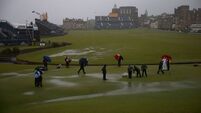 Rain forces early delay at Open