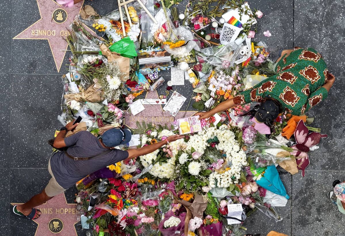 Flowers and remembrances surround Dolly Parton's star on the Hollywood Walk of Fame in Los Angeles this week. Picture: Justin Sullivan/Getty Images