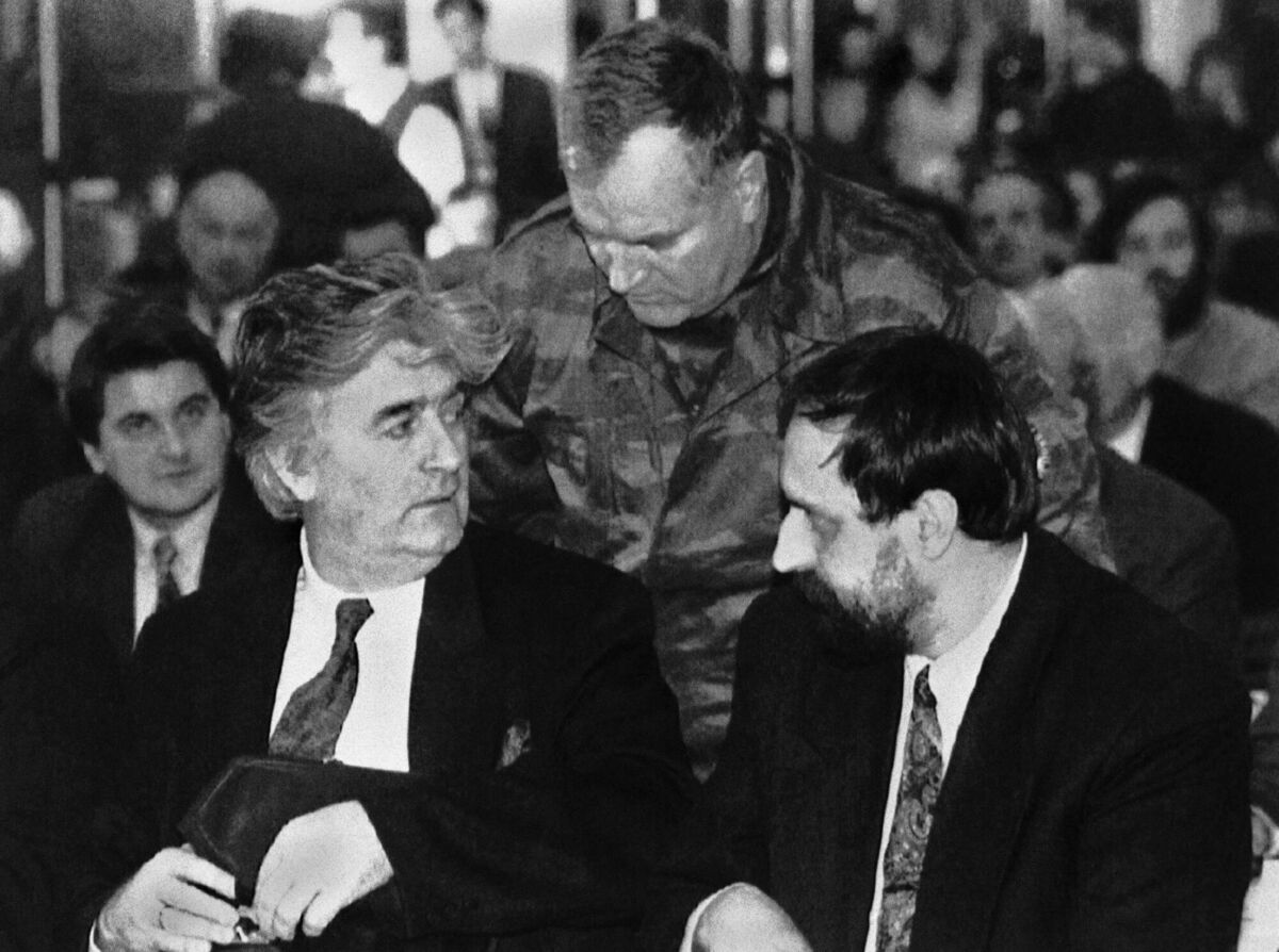Leader of the Bosnian Serbs Radovan Karadzic, left, commander in chief of Bosnia Serbian army Ratko Mladic, centre, and Goran Hadzic, president of the Serbian Krajina Republic in Croatia talk at the start of the parliament session in Pale, Bosnia, in January 1993. Picture Srdjan Ilic/AP Leader of the Bosnian Serbs Radovan Karadzic, left, commander in chief of Bosnia Serbian army Ratko Mladic, centre, and Goran Hadzic, president of the Serbian Krajina Republic in Croatia talk at the start of the parliament session in Pale, Bosnia, in January 1993. Picture Srdjan Ilic/AP