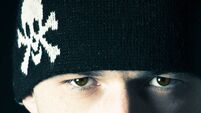Man with a skull on hat