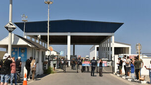 People gather outside the port of Kyrenia (AP Photo) People gather outside the port of Kyrenia (AP Photo)