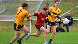 <p>Fossa's Paudie Clifford breaks away from the challenge of Listowel Emmets’ Eddie Healy and Jack McElligott during Sunday's Kerry IFC quarter-final at Fossa. Pic: Tatyana McGough.</p>