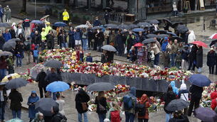 Flowers and cards are laid at the Blue Stone in Bergen (Silje Katrine Robinson /NTB Scanpix/AP) Flowers and cards are laid at the Blue Stone in Bergen (Silje Katrine Robinson /NTB Scanpix/AP)