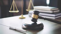 Scales of justice and Gavel on wooden table and Lawyer or Judge working with agreement in Courtroom, Justice and Law concept
