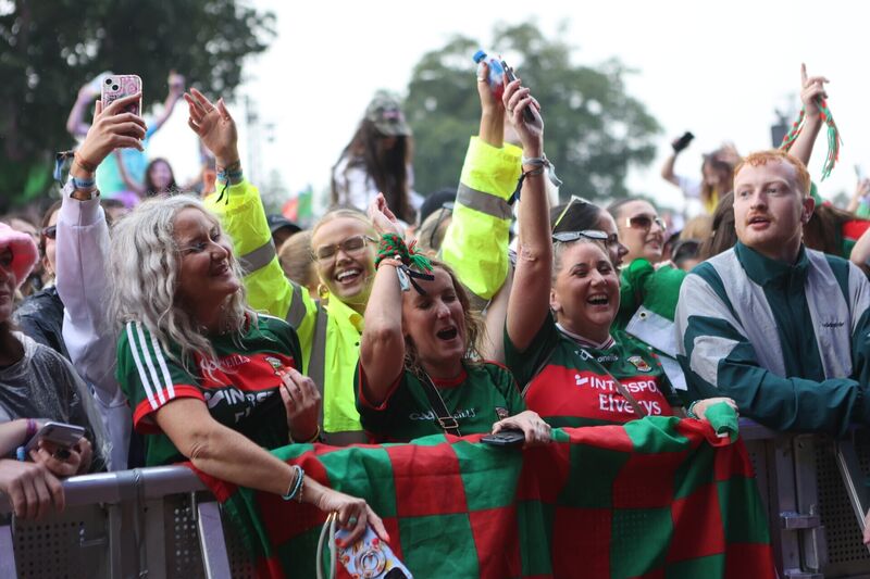Delighted fans, including many in Mayo shirts, enjoying the Saw Doctors' set on the main stage at Electric Picnic. The band was joined on stage by members of the All-Ireland winning Mayo squad. Picture: Evan Treacy/PA