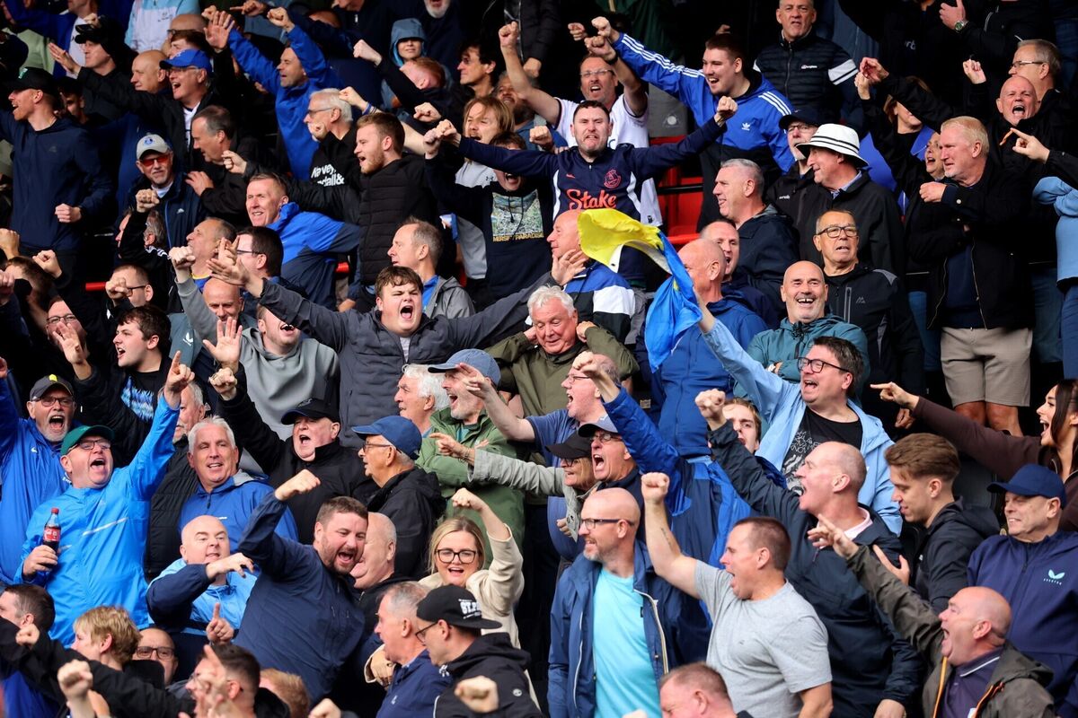 Everton fans celebrate their late equaliser in the stands during the Premier League match at the Vitality Stadium. Pic: Peter Tarry/PA Wire. Everton fans celebrate their late equaliser in the stands during the Premier League match at the Vitality Stadium. Pic: Peter Tarry/PA Wire.