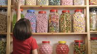 child in sweet shop