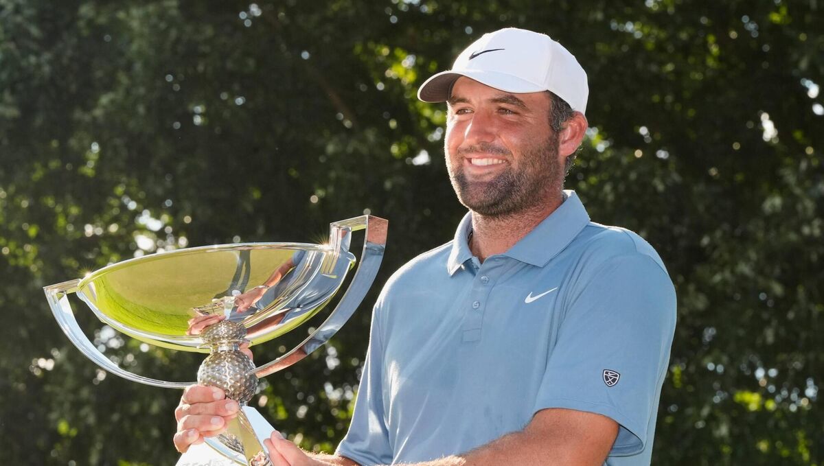 Scottie Scheffler holds the trophy after winning the PGA Tour Championship. Pic: Mike Stewart/AP