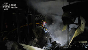 Firefighters put out a fire after a Russian missile attack in Kyiv (Ukrainian Emergency Service/AP) Firefighters put out a fire after a Russian missile attack in Kyiv (Ukrainian Emergency Service/AP)