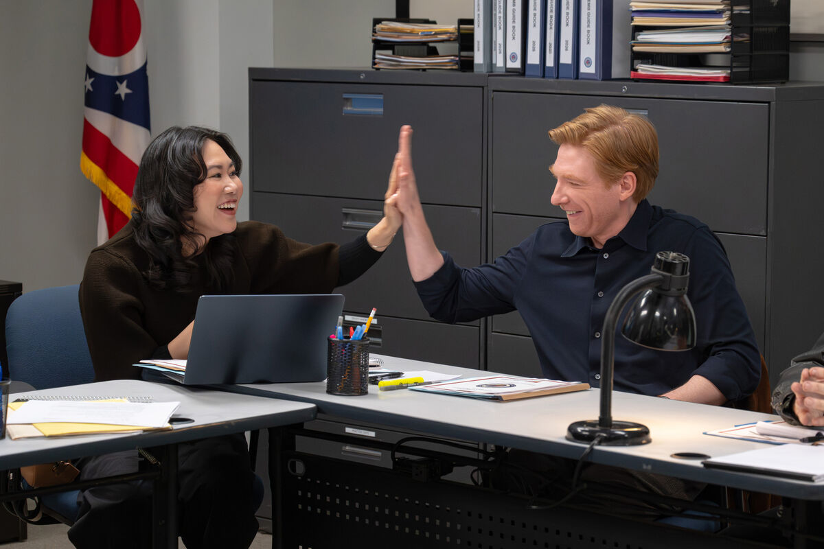 Ramona Young as Nicole &amp; Domhnall Gleeson as Ned in season two of The Paper. Picture: John P. Fleenor/Peacock