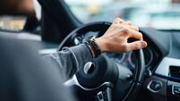 An Unrecognizable Businessman Driving His Car