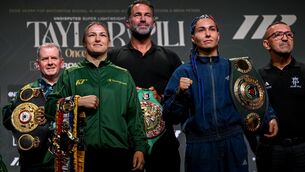 <p>Katie Taylor and Flora Pili, right, square-off in the company of Brian Peters, Katie Taylor's manager, left, and Matchroom Boxing promoter Eddie Hearn. Pic: Stephen McCarthy/Sportsfile</p> <p>Katie Taylor and Flora Pili, right, square-off in the company of Brian Peters, Katie Taylor's manager, left, and Matchroom Boxing promoter Eddie Hearn. Pic: Stephen McCarthy/Sportsfile</p>