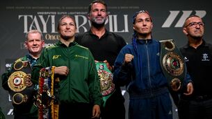<p>Katie Taylor and Flora Pili, right, square-off in the company of Brian Peters, Katie Taylor's manager, left, and Matchroom Boxing promoter Eddie Hearn. Pic: Stephen McCarthy/Sportsfile</p> <p>Katie Taylor and Flora Pili, right, square-off in the company of Brian Peters, Katie Taylor's manager, left, and Matchroom Boxing promoter Eddie Hearn. Pic: Stephen McCarthy/Sportsfile</p>