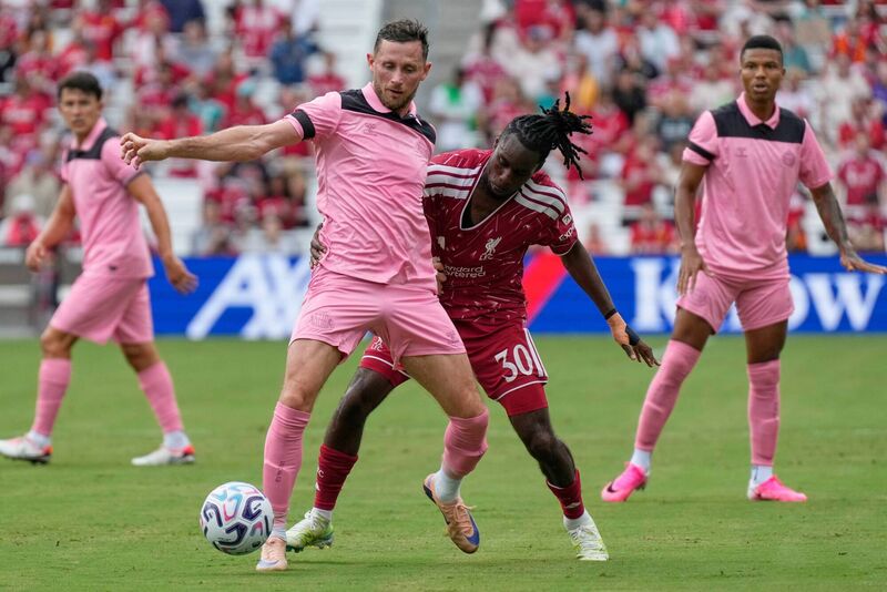 Sunderland midfielder Alan Browne, left, and Liverpool FC defender Jeremie Frimpong battle for the ball. Pic: AP Photo/George Walker IV Sunderland midfielder Alan Browne, left, and Liverpool FC defender Jeremie Frimpong battle for the ball. Pic: AP Photo/George Walker IV
