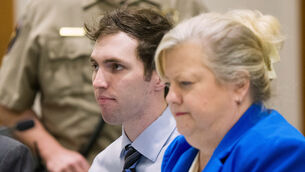 Tyler Robinson, who is accused of fatally shooting Charlie Kirk, sits beside his defence lawyer during a hearing in January (Bethany Baker/The Salt Lake Tribune via AP)