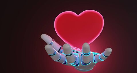 Robotic arm having a glowing red heart floating above its palm on dark background. Illustration of the concept of emotion artifi