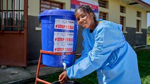 <p>Imani, a nurse at Bogoro Health Centre, washes her hands at a handwashing station installed outside the health facility as part of Ebola prevention measures. </p> <p>Imani, a nurse at Bogoro Health Centre, washes her hands at a handwashing station installed outside the health facility as part of Ebola prevention measures. </p>