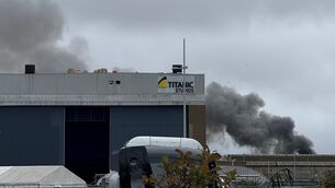 <p>Smoke rises from Queen's Island in Belfast where a major blaze has broken out. Picture: Elly Rewcastle/PA Wire</p>