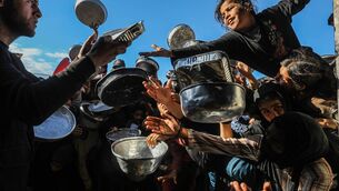 <p>Palestinians, mainly children, waiting to get hot food distributed by a charity in March in Khan Yunis, Gaza, as food shortages continued amid Israeli attacks and ongoing restrictions on the entry of aid. Picture: Abed Rahim Khatib/Anadolu/Getty </p>