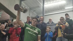 <p>CHAMPIONS: Jackie Dwane collects the Limerick Minor Hurling Championship title for Kilmallock.</p>