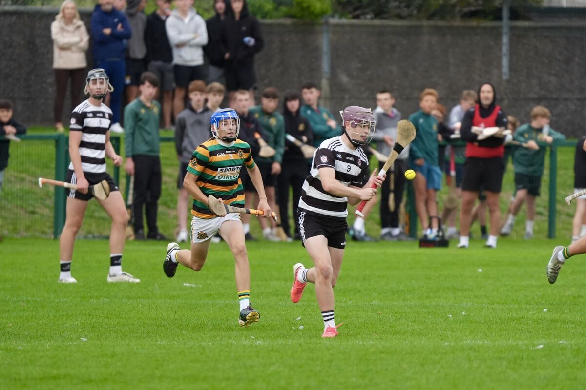Midleton’s Braden Dunlap shoots towards the goals as The Glen’s James Murray closes in. Pic: Noel Sweeney