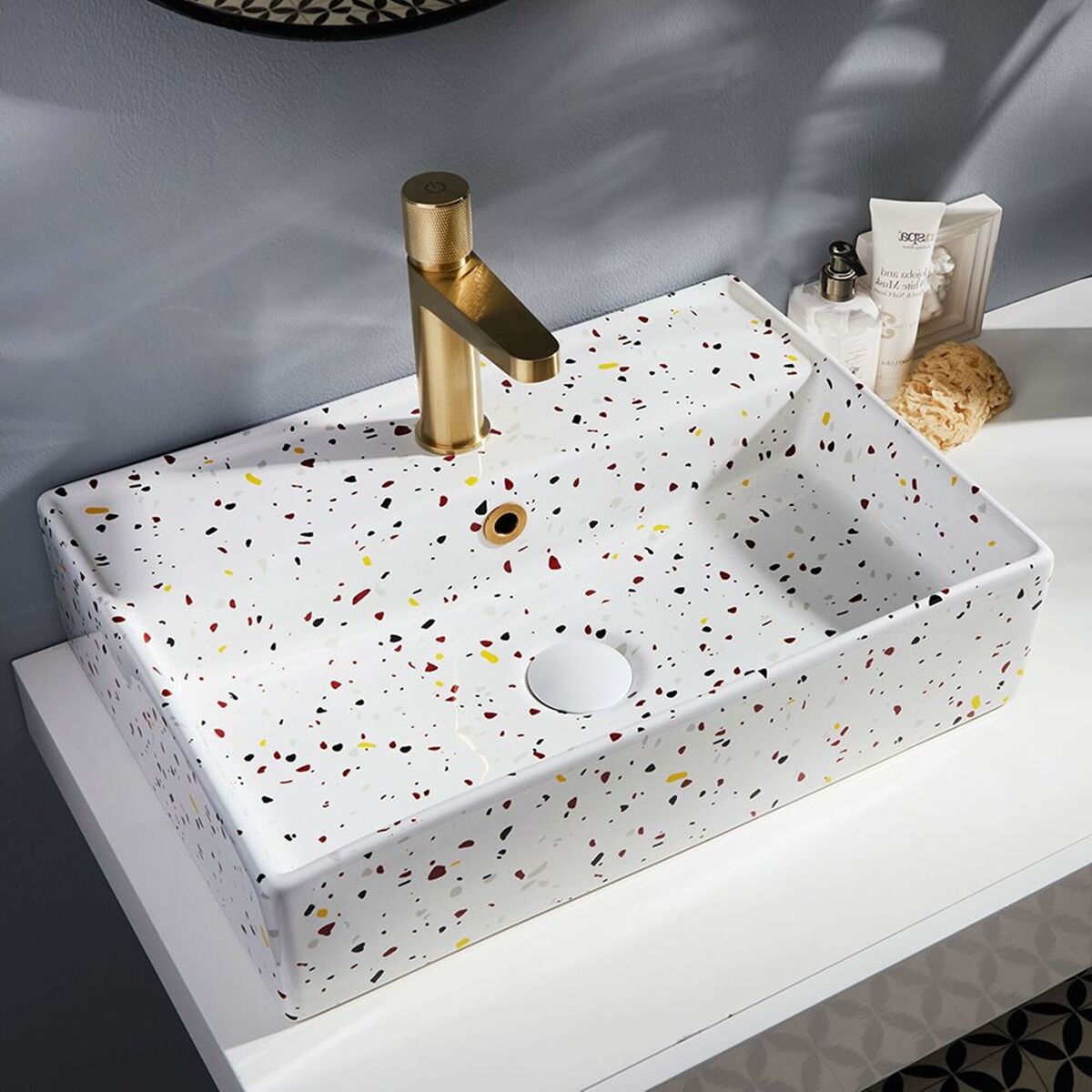 A highly affordable, design-led duo, here a Milano Elswick basin in bold Terrazzo style is matched to a sink-mounted mixer. The knurled engine-turned control and warm brushed brass finish to the mixer is right on trend. Elswick basin €194, Milano Orta tap €174, bigbathroomshop.ie.