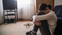 Teen woman with headache holding her head