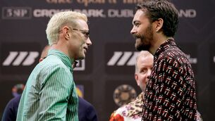 <p>FAMILAIR FACE OFF: Paddy Donovan and Tyrone McKenna. Pic: INPHO/Gary Carr</p>