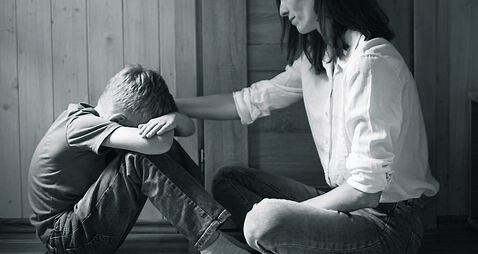 Parent comforting helping sad emotional child at home, concept of bullying, stress disappointment, sadness.