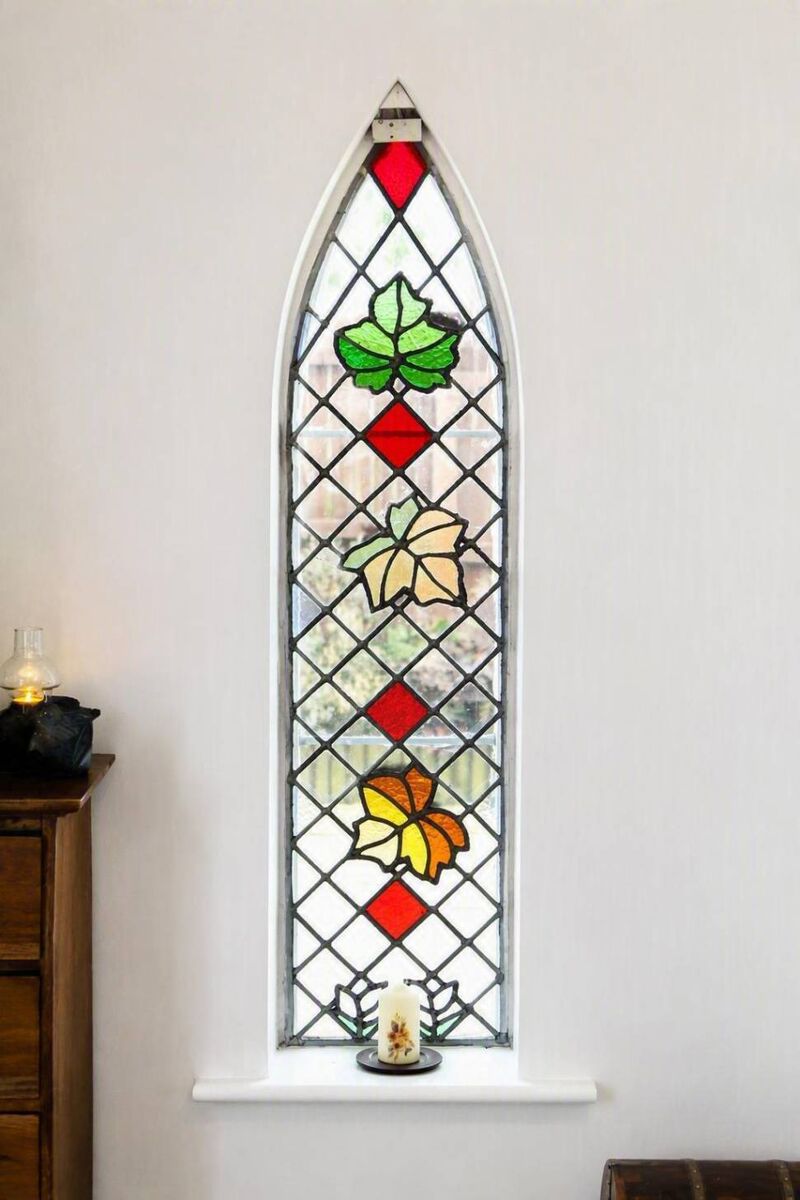 The sycamore themed stained glass window at Sycamore House The sycamore themed stained glass window at Sycamore House