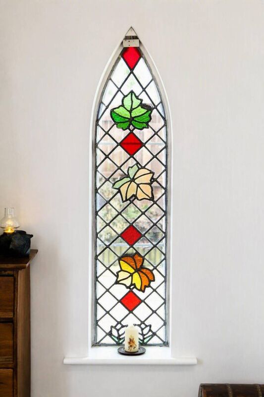 The sycamore themed stained glass window at Sycamore House The sycamore themed stained glass window at Sycamore House