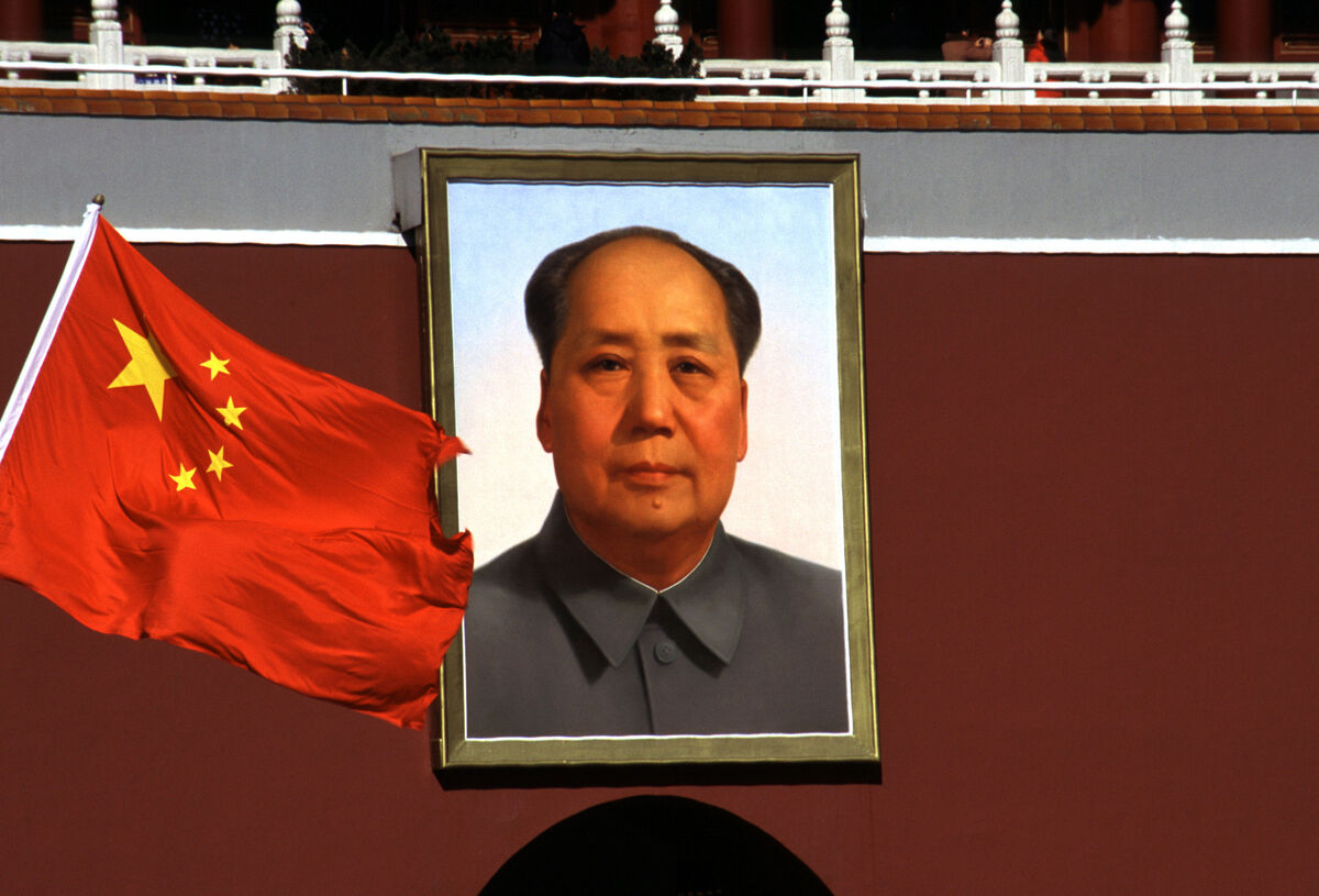 Photograph of a portrait of Chairman Mao Zedong and the Chinese flag in the Forbidden City Beijing. Photograph of a portrait of Chairman Mao Zedong and the Chinese flag in the Forbidden City Beijing.