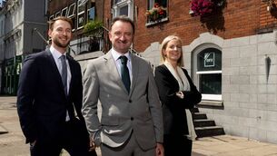 <p>O'Flynn Exhams new roles: Sarah O’Keeffe and Darragh Muldoon with Micheál Ó Mulláin, managing partner. </p>