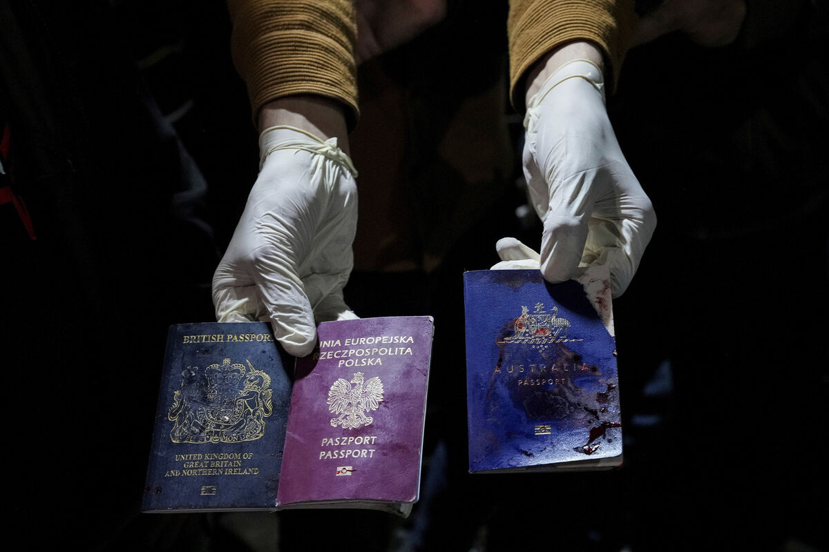 A man displays blood-stained British, Polish, and Australian passports after an Israeli airstrike, in Deir al-Balah, Gaza Strip, Monday, April 1, 2024. (AP Photo/Abdel Kareem Hana) A man displays blood-stained British, Polish, and Australian passports after an Israeli airstrike, in Deir al-Balah, Gaza Strip, Monday, April 1, 2024. (AP Photo/Abdel Kareem Hana)