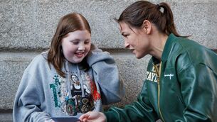 <p>Young fan Leanne meets Katie Taylor after the weight in. Picture: ©INPHO/James Crombie</p>