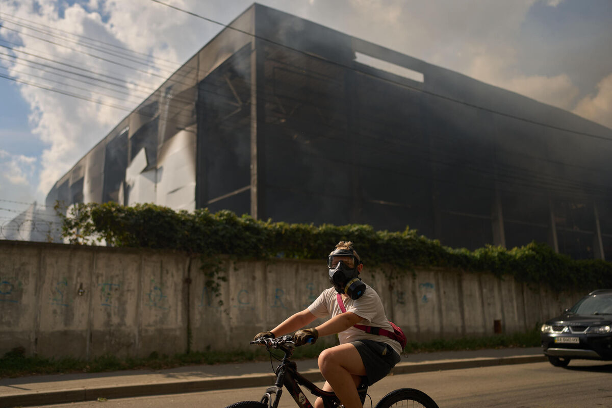 A local resident wears a gas mask as he rides a bicycle past a partially destroyed warehouse after a Russian drone attack in Brovary on the outskirts of Kyiv, Ukraine, Friday, Sept. 4, 2026. (AP Photo/Francisco Seco) A local resident wears a gas mask as he rides a bicycle past a partially destroyed warehouse after a Russian drone attack in Brovary on the outskirts of Kyiv, Ukraine, Friday, Sept. 4, 2026. (AP Photo/Francisco Seco)