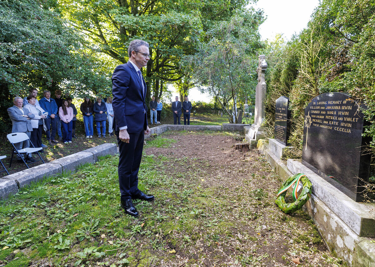 Culture minister Patrick O'Donovan laying a wreath at the grave of Violet Irwin. Picture: Arthur Ellis