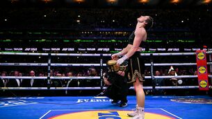 <p>Katie Taylor places her gloves onto the centre of the ring after her undisputed super lightweight championship fight with Flora Pili. Pic: Stephen McCarthy/Sportsfile</p> <p>Katie Taylor places her gloves onto the centre of the ring after her undisputed super lightweight championship fight with Flora Pili. Pic: Stephen McCarthy/Sportsfile</p>