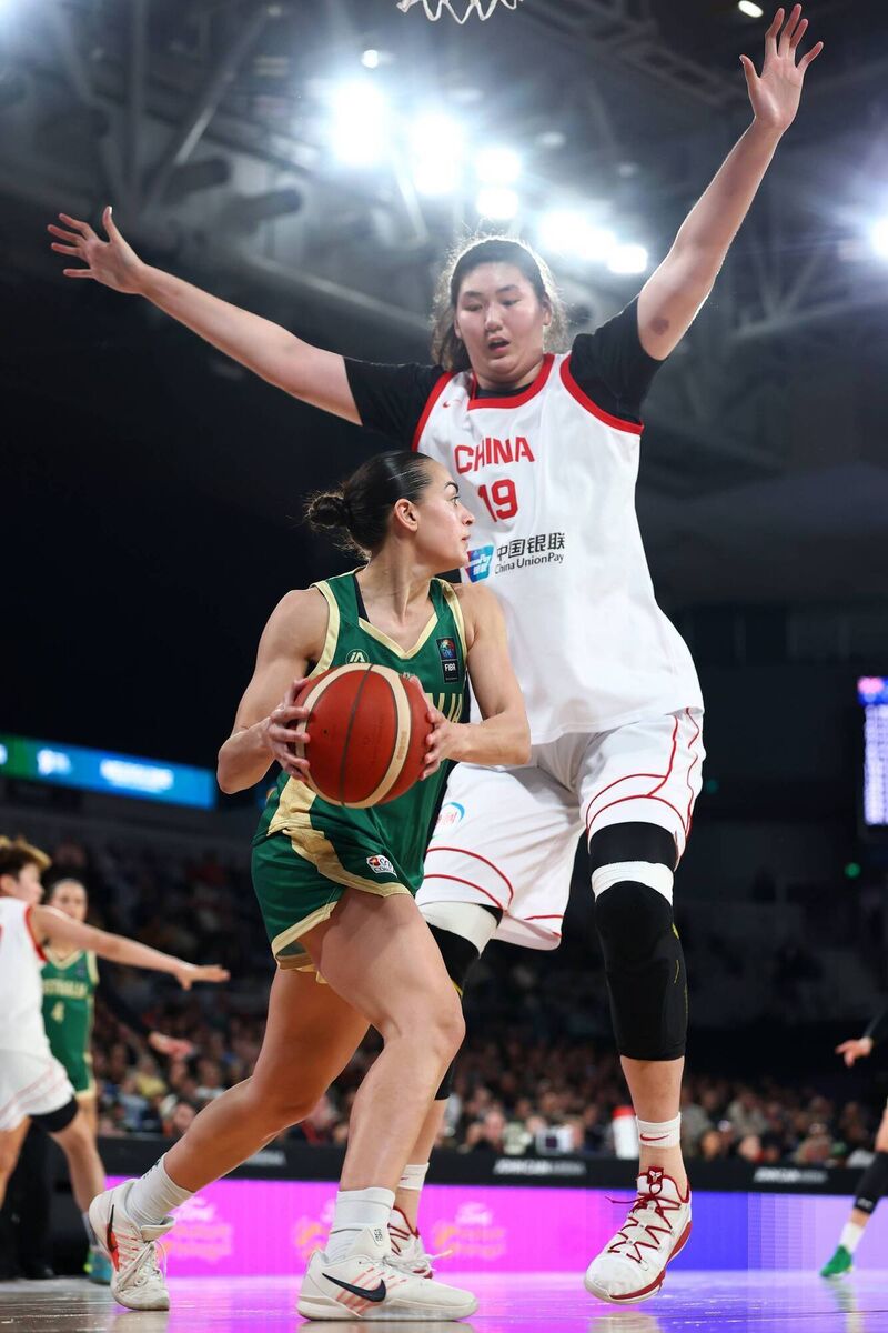 TALL ORDER: Australia's Maddy Rocci looks to work the ball around the sizeable impediment of China's Ziyu Zhang of China. Pic: Daniel Pockett/Getty Images TALL ORDER: Australia's Maddy Rocci looks to work the ball around the sizeable impediment of China's Ziyu Zhang of China. Pic: Daniel Pockett/Getty Images