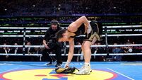 Katie Taylor lays her boxing gloves on the canvas to signify her retirement 5/9/2026