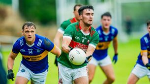 <p>Paul O'Shea of Kilcummin in action against Glenflesk's Darragh Roche in the Kerry IFC semi-final. Pic Tatyan McGough</p>