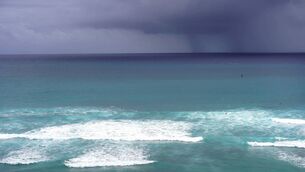 <p>Large waves breaking off Diamond Head Beach Park in Honolulu as Hawaii prepares for the effects of Hurricane Lowell. (Photo by Michelle Bir / AFP via Getty Images).</p>