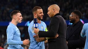 <p>Phil Foden and Kyle Walker of Manchester City speaks to Thierry Henry of CBS after the team's victory the UEFA Champions League semi-final second leg match between Manchester City FC and Real Madrid at Etihad Stadium on May 17, 2023 in Manchester, England. (Photo by Michael Regan/Getty Images)</p>