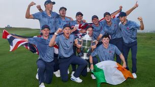 <p>Team Great Britain &amp; Ireland celebrate with the Walker Cup. Pic: ©INPHO/Ben Brady.</p>
