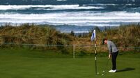 Rory McIlroy practices at the 15th hole 8/9/2026